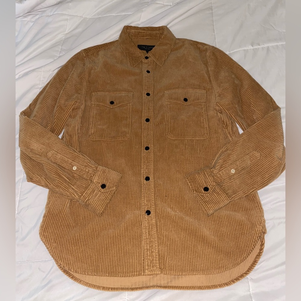 Never worn Unisex corduroy snap closure shirt.